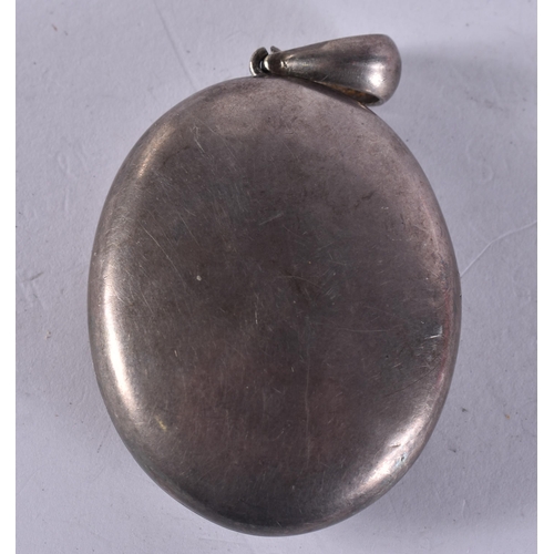 1253 - Sterling Silver Antique Locket (36g). 6 cm x 3 cm.