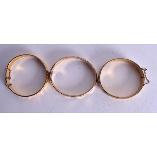 1327 - THREE GOLD FILLED BANGLES. 73 grams. (3)