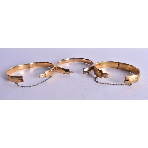 1327 - THREE GOLD FILLED BANGLES. 73 grams. (3)