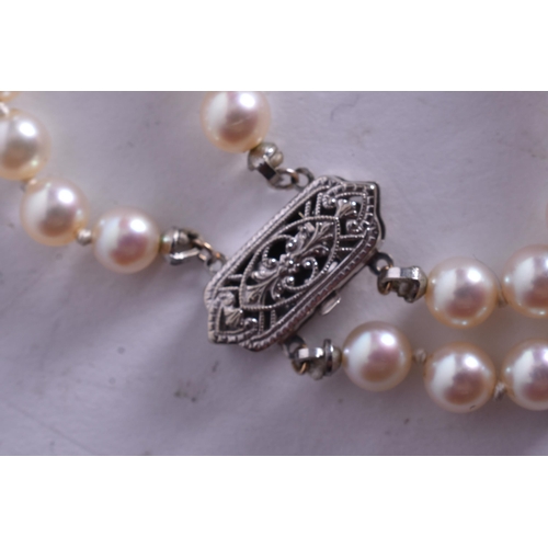 1351 - A PEARL NECKLACE WITH A 14CT GOLD CLASP. 33.8 grams. 38 cm long.