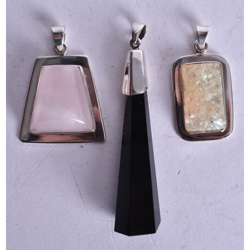 1357 - THREE SILVER AND STONE PENDANTS. 37.5 grams. (3)
