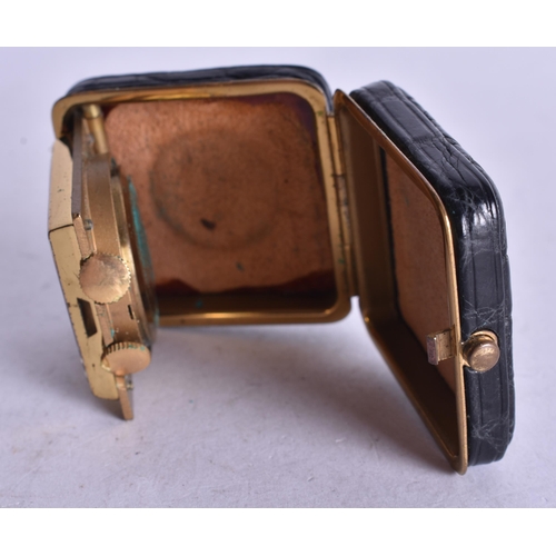 1359 - A VINTAGE LEATHER CASED TRAVELLING WATCH. Running. 4.25 cm square.