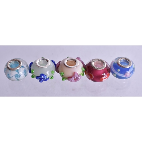 1362 - TEN SILVER MOUNTED CHARMS. 27 grams. (10)