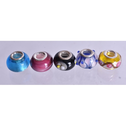 1362 - TEN SILVER MOUNTED CHARMS. 27 grams. (10)