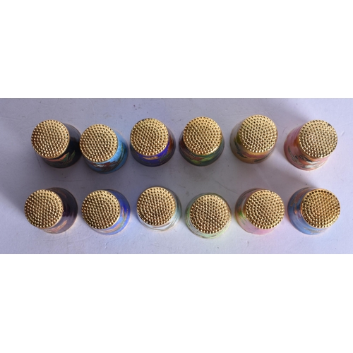1363 - TWELVE CHINESE CLOISONNE ENAMEL THIMBLES. 130 grams. 2.5 cm x 2 cm. (12)