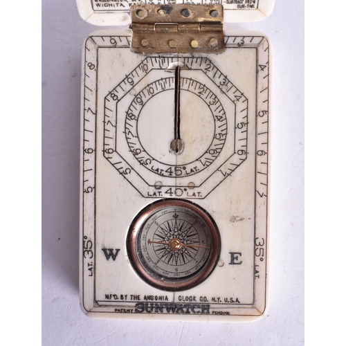 1367 - A SCRIMSHAW DECORATED COMPASS. 9.5 cm x 6 cm.