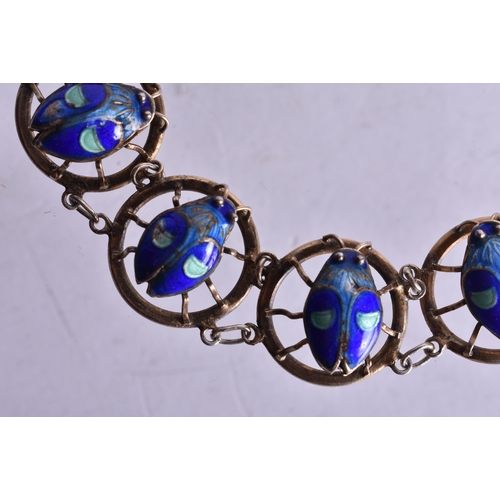 1381 - AN UNUSUAL ENAMELLED LADYBIRD BRACELET. 13.5 grams. 14.5 cm long.