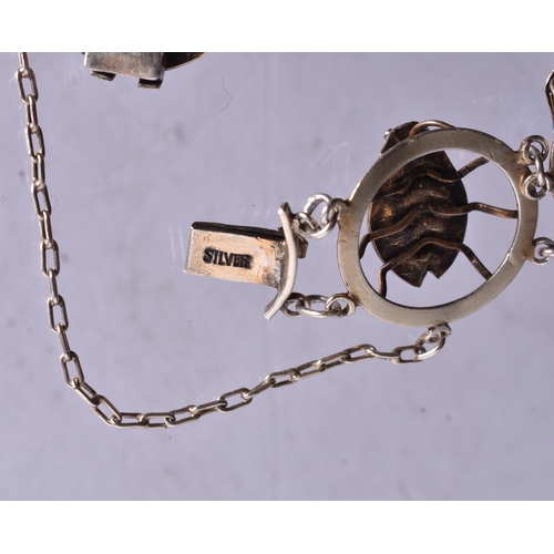 1381 - AN UNUSUAL ENAMELLED LADYBIRD BRACELET. 13.5 grams. 14.5 cm long.