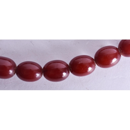 1394 - Cherry Bakelite Bead Necklace (24g). 40 cm long, each bead 0.75 cm wide.