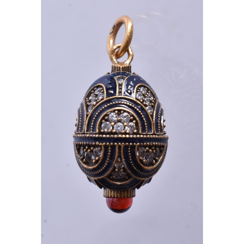 1471 - A Silver Gilt and Enamel Gem Set Pendant.  2.9cm x 1.5cm, weight 5.9g