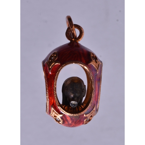 1476 - A 14 Carat Gold and Red Enamel Pendant inset with an Elephant.  Stamped 56, 2.6cm x 1.3cm x 1.3cm, w... 