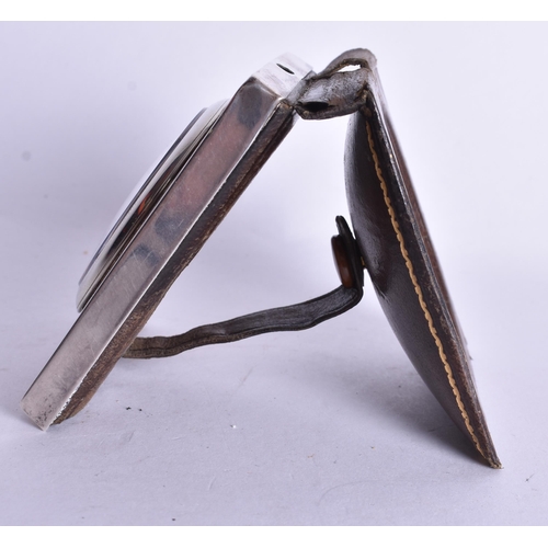 1524 - A Silver Cased Travel Clock with a fitted Leather Cover.  Not working.  Hallmarked London 1924.  7.6... 