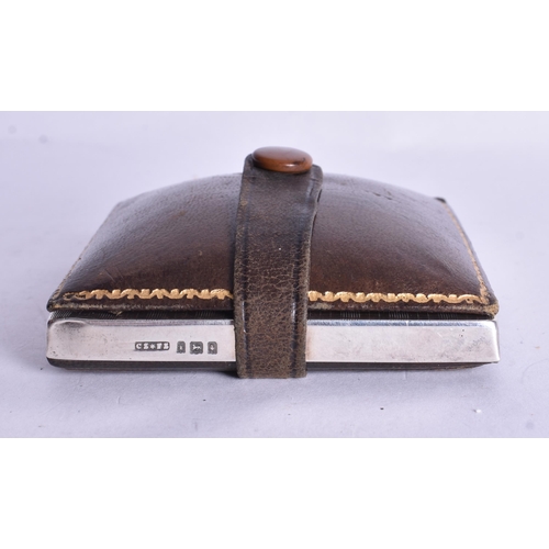 1524 - A Silver Cased Travel Clock with a fitted Leather Cover.  Not working.  Hallmarked London 1924.  7.6... 