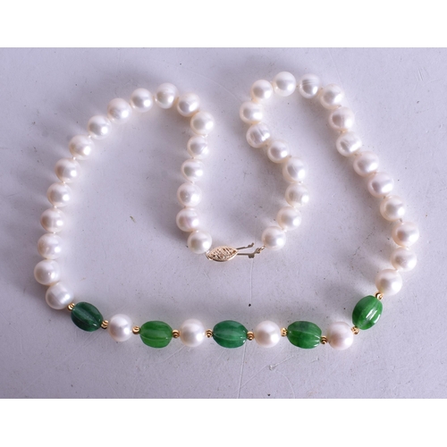 1543 - A Hardstone Bead Necklace with a 14 Carat Gold Clasp.  Stamped 14K, Bead Size 9mm, 46cm long, weight... 