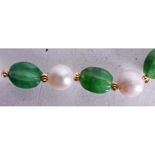 1543 - A Hardstone Bead Necklace with a 14 Carat Gold Clasp.  Stamped 14K, Bead Size 9mm, 46cm long, weight... 