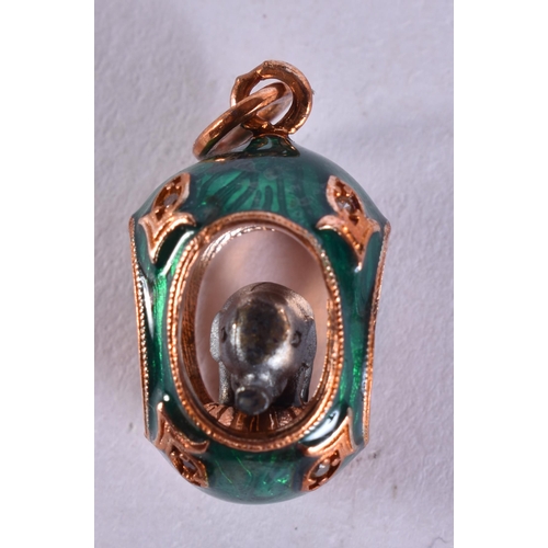 1641 - A Continental 14 Carat Gold Mounted Egg Pendant inset with an Elephant .  Stamped 56, 2.7cm x 1.3cm,... 