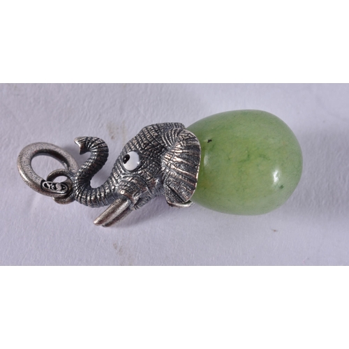 1648 - A Continental Silver Elephant Mounted Jade Egg Pendant.  Stamped 84.  3.5cm x 1.2cm, weight 8.8g