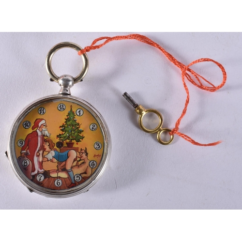 1673 - An Erotic Pocket Watch with a Christmas Themed Dial, with Key.  Working, Key Wind.  4.8cm diameter