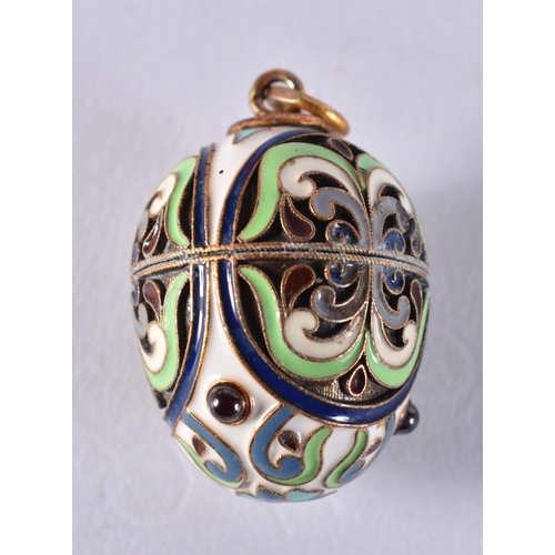 1692 - A Continental Silver and Enamel Egg Pendant.  Stamped 84.  3.6cm x 2.1cm, weight 9.4g
