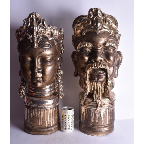 1843 - A LARGE PAIR OF ORIENTAL STYLE POTTERY BUSTS. 63 cm high.