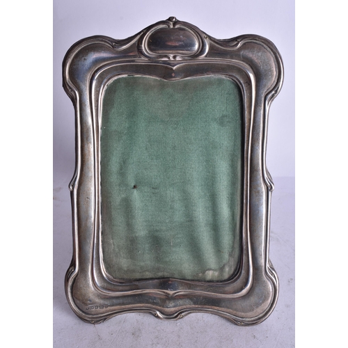 1893 - An Edwardian Silver Mounted Wooden Picture Frame.  Hallmarked Birmingham 1902, vacant cartouche.  20... 