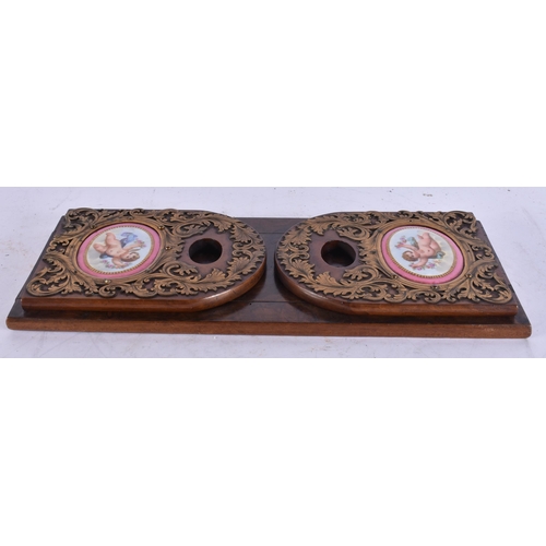 1934 - AN ANTIQUE BURR WALNUT AND SEVRES PORCELAIN BOOKRACK. 32 cm x 16 cm.