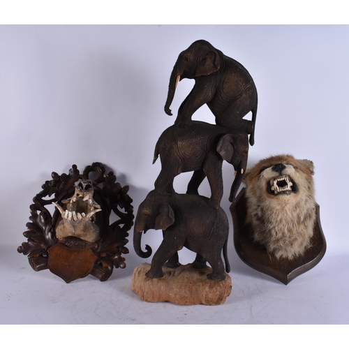 1937 - A LARGE AFRICAN TRIBAL FIGURE together with taxidermy etc. Largest 50 cm long. (3)