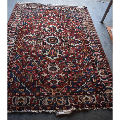 1970 - A LARGE PERSIAN CARPET.