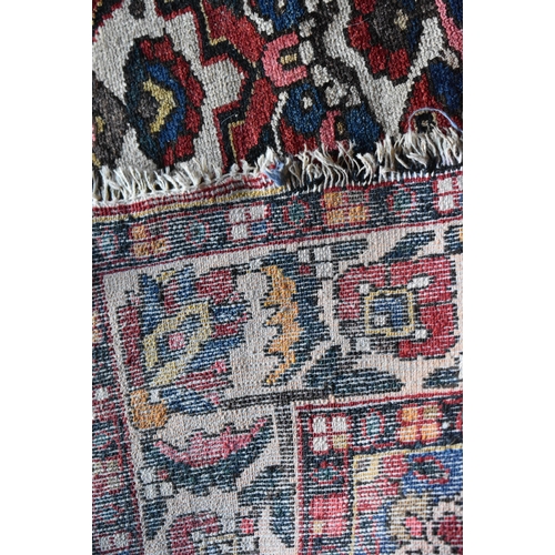 1970 - A LARGE PERSIAN CARPET.