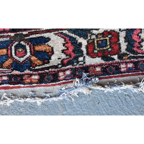 1970 - A LARGE PERSIAN CARPET.