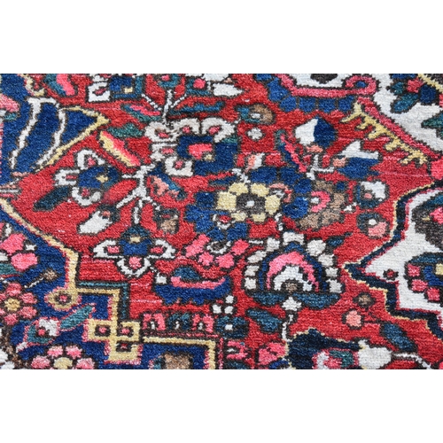 1970 - A LARGE PERSIAN CARPET.