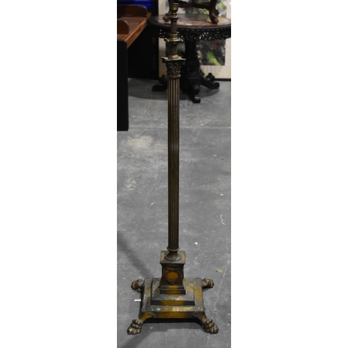 1974 - A BRASS COLUMN CANDLESTICKS. 130 cm high.