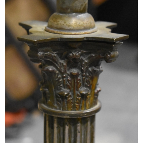1974 - A BRASS COLUMN CANDLESTICKS. 130 cm high.
