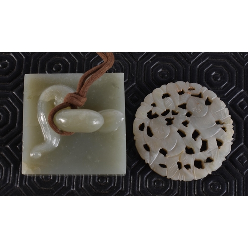 2017 - A 19TH CENTURY CHINESE RETICULATED JADE PLAQUE together with a jade seal. Largest 5.25 cm square. (2... 