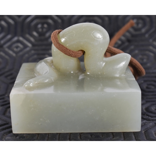 2017 - A 19TH CENTURY CHINESE RETICULATED JADE PLAQUE together with a jade seal. Largest 5.25 cm square. (2... 