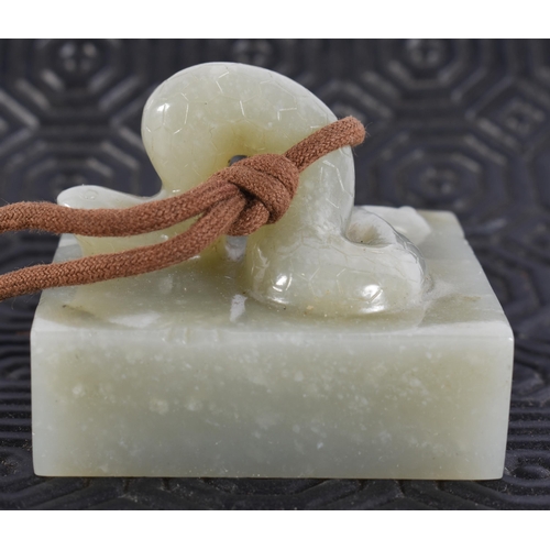 2017 - A 19TH CENTURY CHINESE RETICULATED JADE PLAQUE together with a jade seal. Largest 5.25 cm square. (2... 