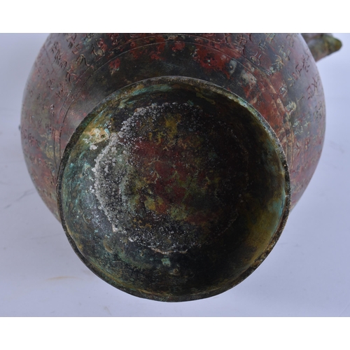 2028 - A LARGE CHINESE TWIN HANDLED BRONZE VASE incised with calligraphy. 50 cm x 28 cm.