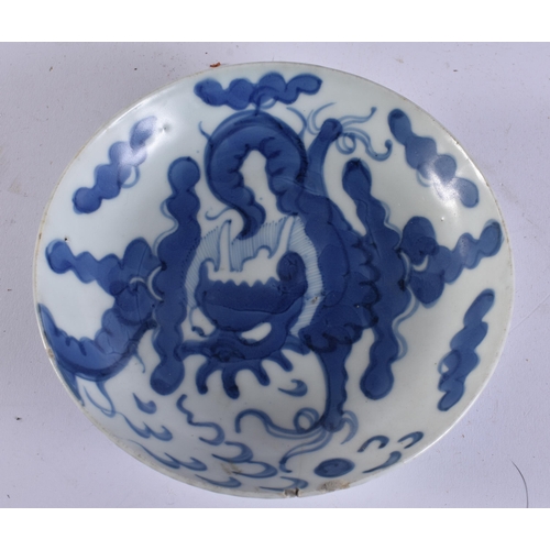 2039 - A CHINESE QING DYNASTY BLUE AND WHITE PORCELAIN DRAGON DISH together with other porcelain. Largest 1... 