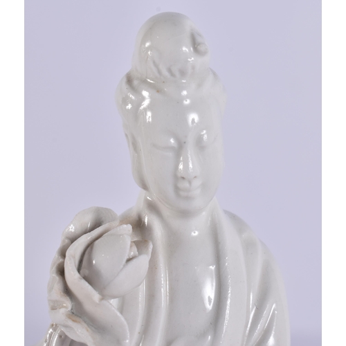 2079 - A CHINESE BLANC DE CHINE PORCELAIN FIGURE together with a stone immortal. Largest 24 cm high. (2)