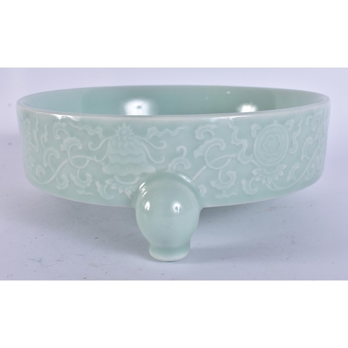 2104 - A CHINESE CELADON RAISED RELIEF DECORATED PORCELAIN CENSER. 18 cm wide.