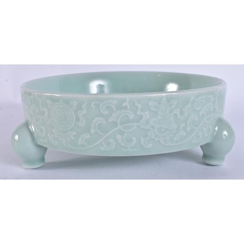 2104 - A CHINESE CELADON RAISED RELIEF DECORATED PORCELAIN CENSER. 18 cm wide.