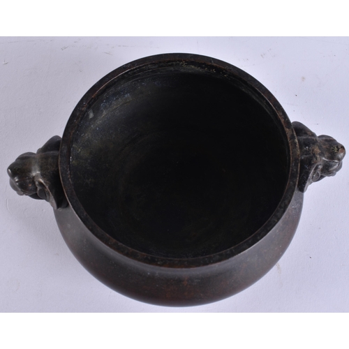 2173 - A CHINESE TWIN HANDLED BRONZE CENSER. 617 grams. 16 cm x 12.5 cm.