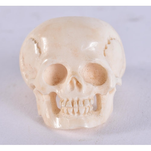 2224 - A CARVED BONE SKULL RING. 13 grams. Z.