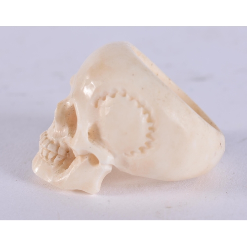 2224 - A CARVED BONE SKULL RING. 13 grams. Z.