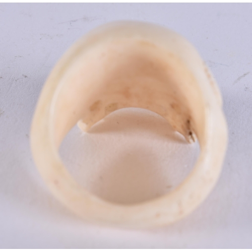 2224 - A CARVED BONE SKULL RING. 13 grams. Z.