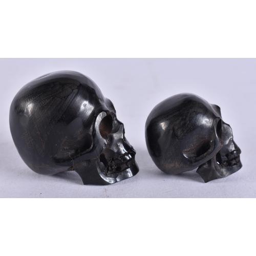 2236 - TWO MEMENTO MORI HORN SKULLS. 1.9 grams. 3.25 cm x 3 cm.