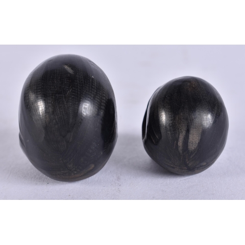 2236 - TWO MEMENTO MORI HORN SKULLS. 1.9 grams. 3.25 cm x 3 cm.