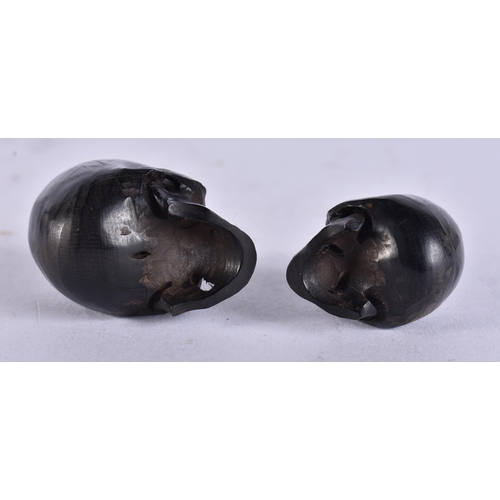 2236 - TWO MEMENTO MORI HORN SKULLS. 1.9 grams. 3.25 cm x 3 cm.