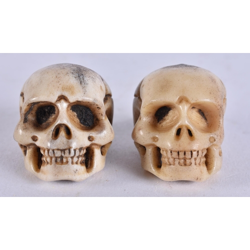 2242 - TWO MEMENTO MORI CARVED ANTLER HORN SKULLS. 28 grams. 2.75 cm x 2.75 cm. (2)