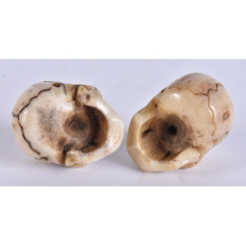 2242 - TWO MEMENTO MORI CARVED ANTLER HORN SKULLS. 28 grams. 2.75 cm x 2.75 cm. (2)